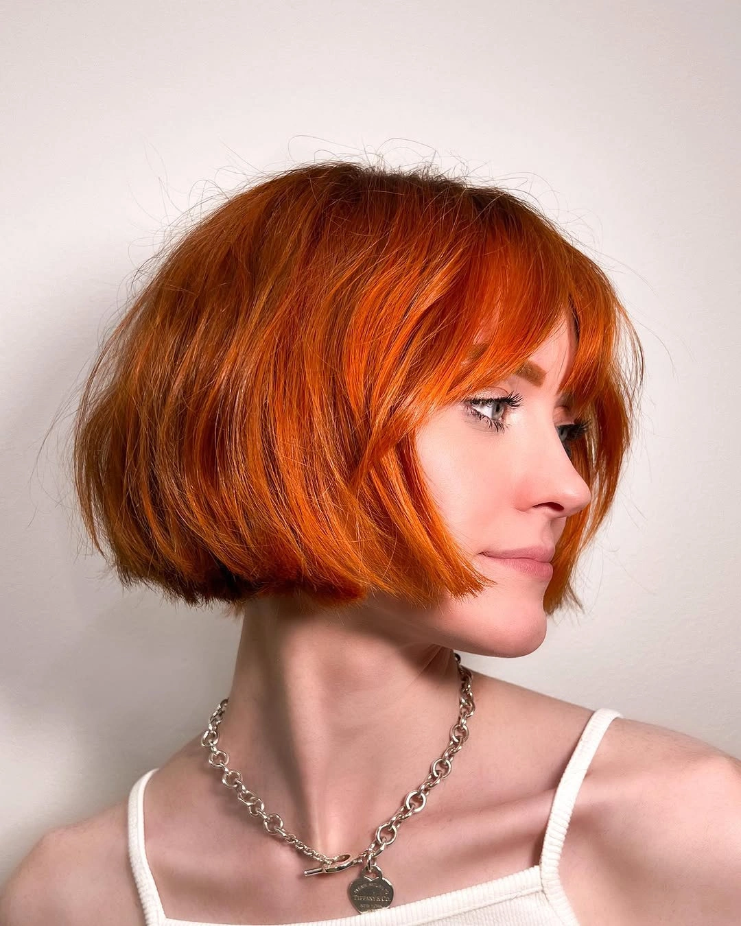 french bob cut Copper Bob With Feathered Fringe