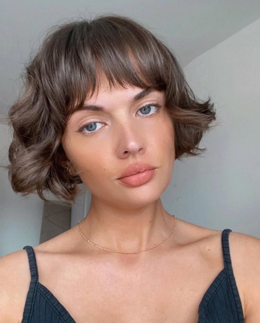french bob cut Brunette Bob With Soft Curtain Bangs