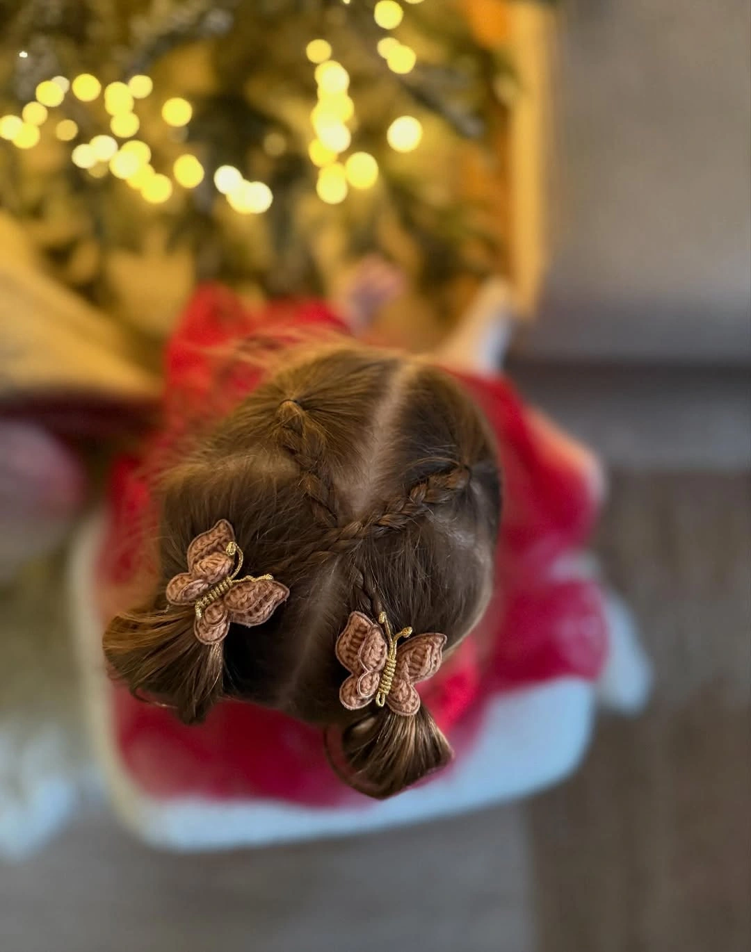 glamorous christmas hairstyles 2026 - Playful half-up hairstyle with butterfly clips