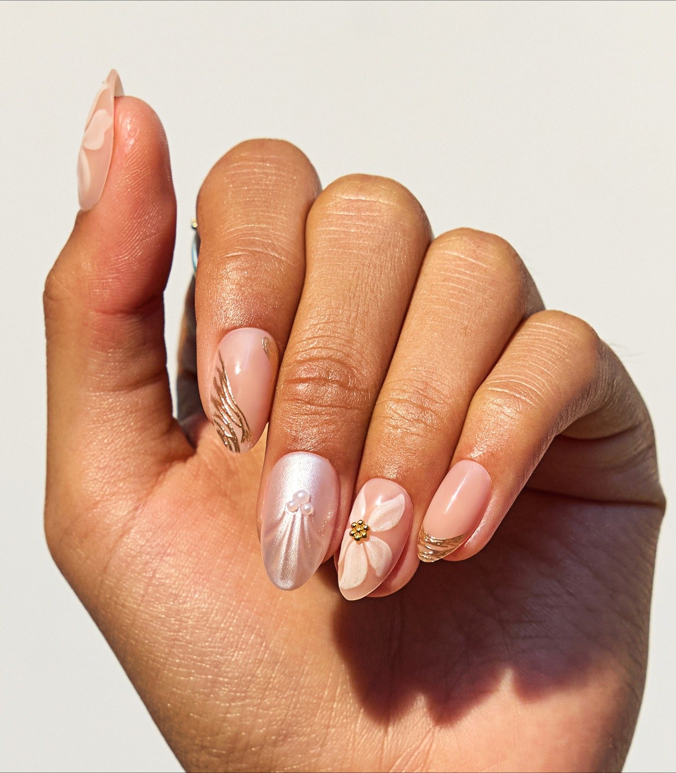 Pearlescent Pink Oval Nails with Floral Charm Pearlescent Pink Oval Nails with Floral Charm β Winter Oval Nails