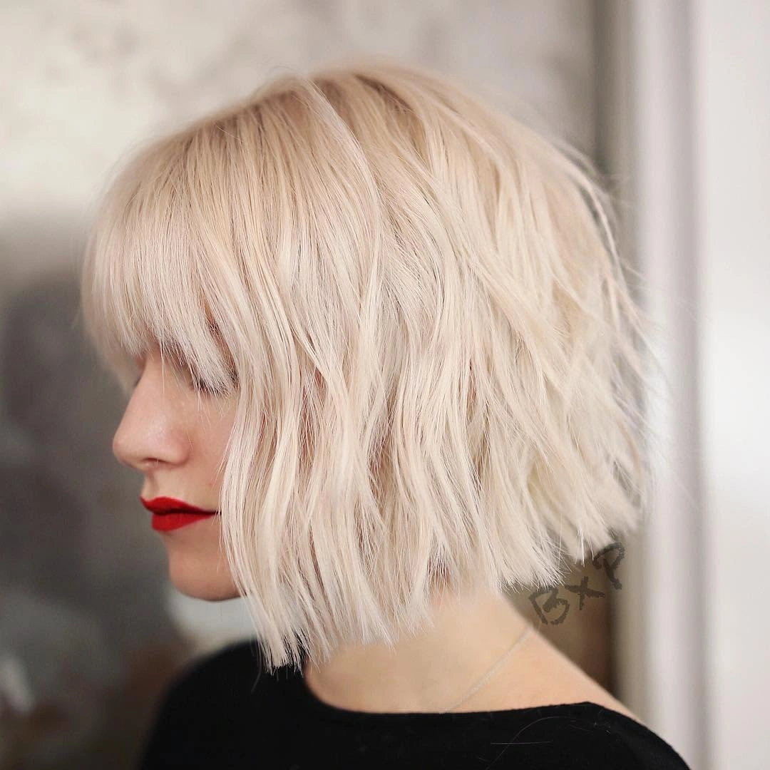 modern bobbed haircut Platinum Wavy Bob With Statement Fringe