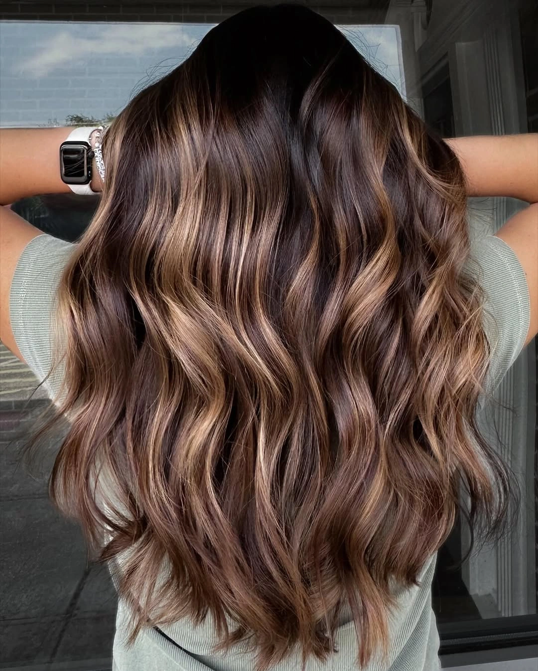 rich and cozy winter hair color ideas for brunettes Warm Bronde Balayage With Flowing Waves