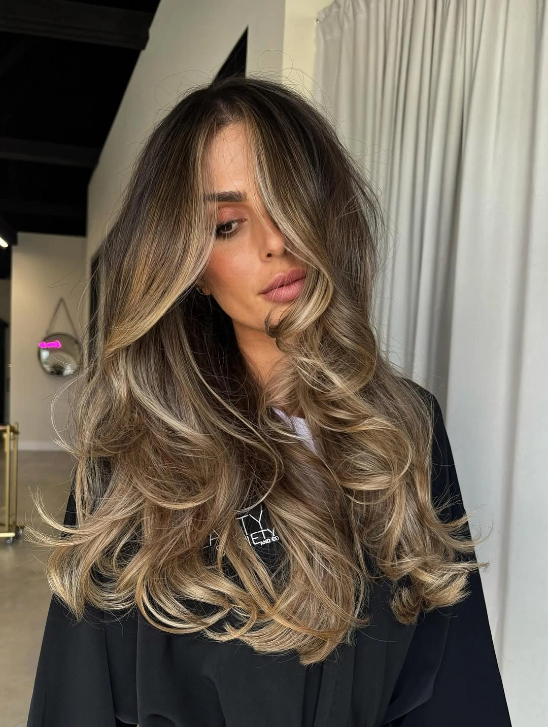 rich and cozy winter hair color ideas for brunettes Caramel Balayage With Face-Framing Lightness