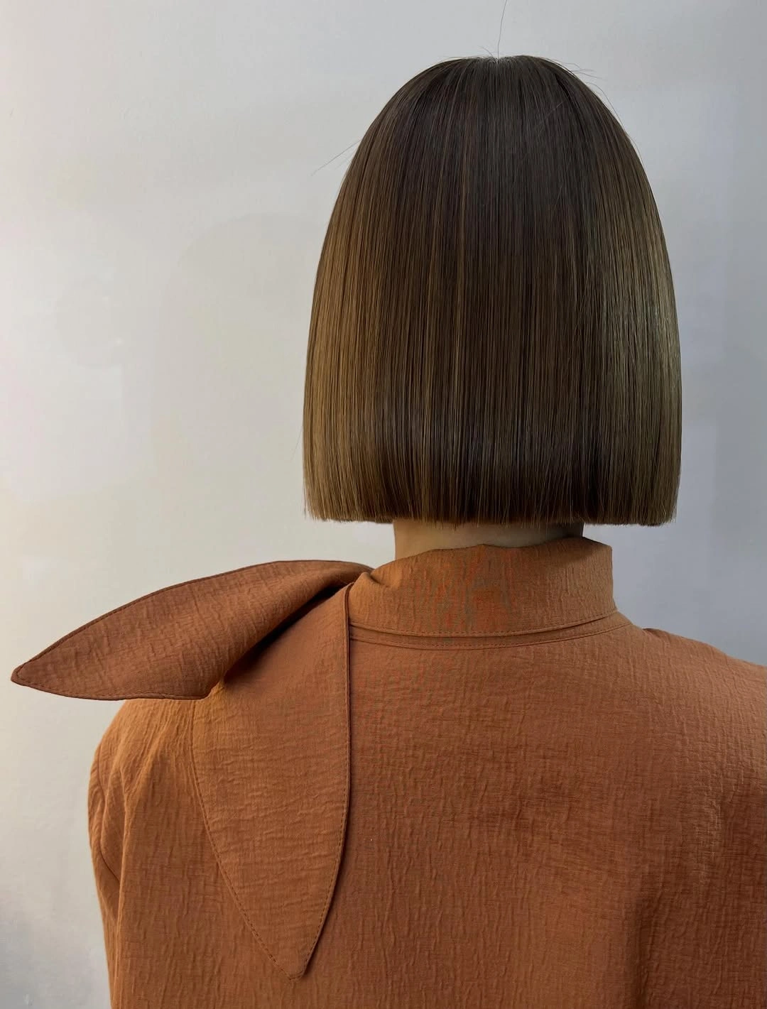 short bob hairstyle Precision Brown Bob With a Clean Back