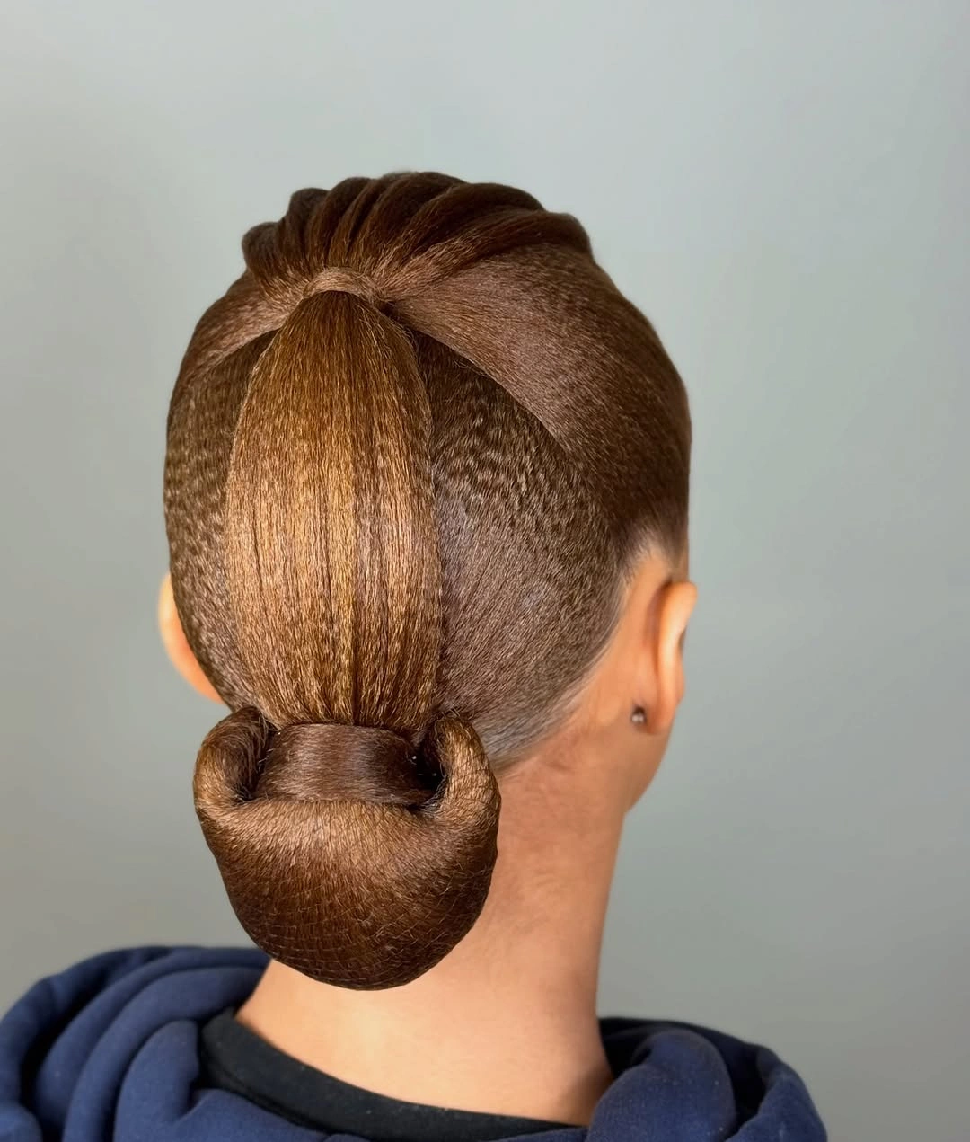 sstylish sports hairstyle Low Sculpted Bun With a Wrapped Crown