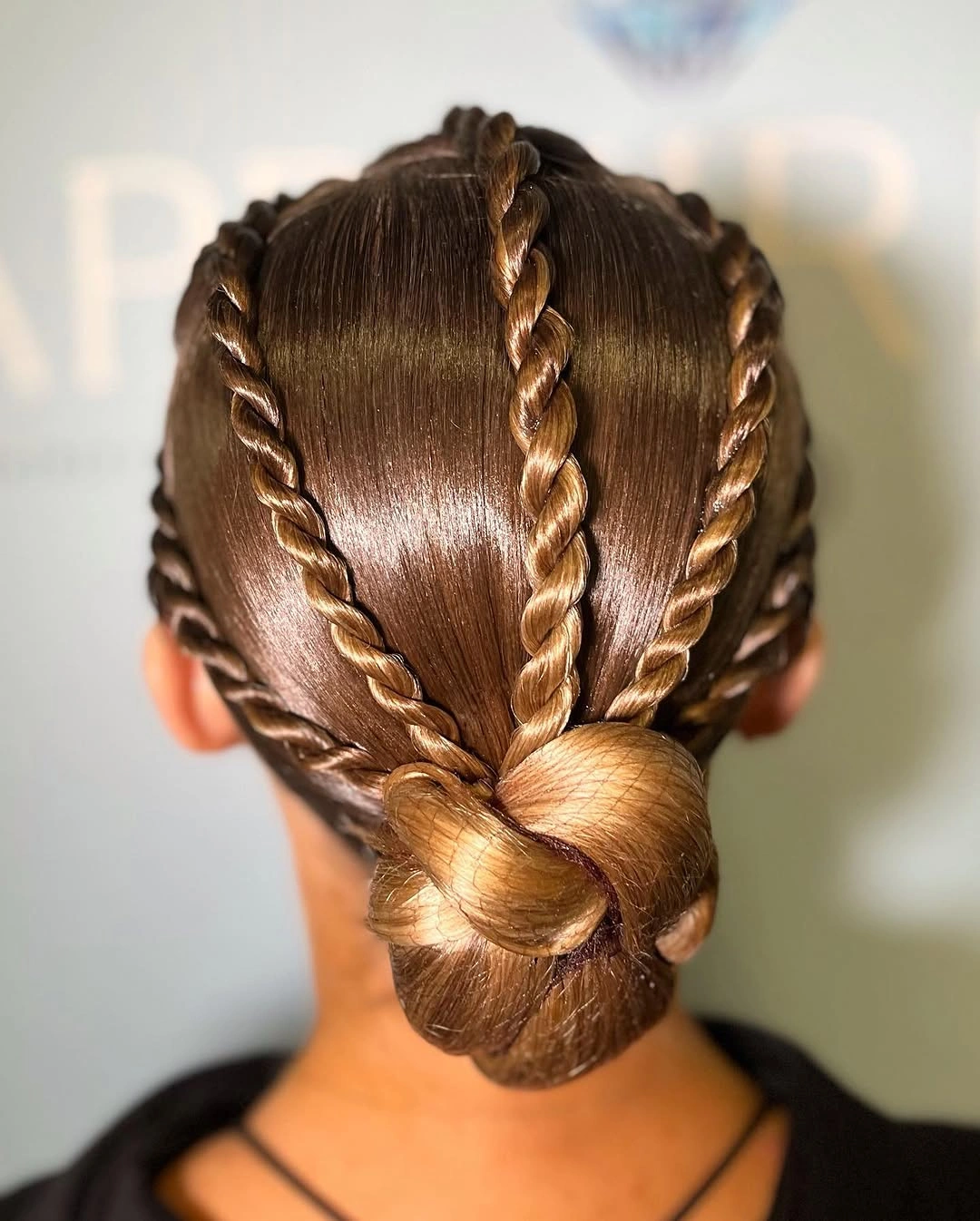 sstylish sports hairstyle Twisted Braids Gathered Into a Sculptural Bun