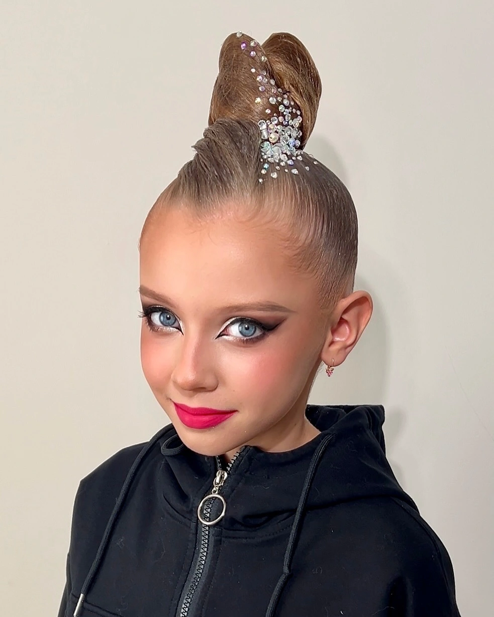 sstylish sports hairstyle High Bun With a Statement Finish