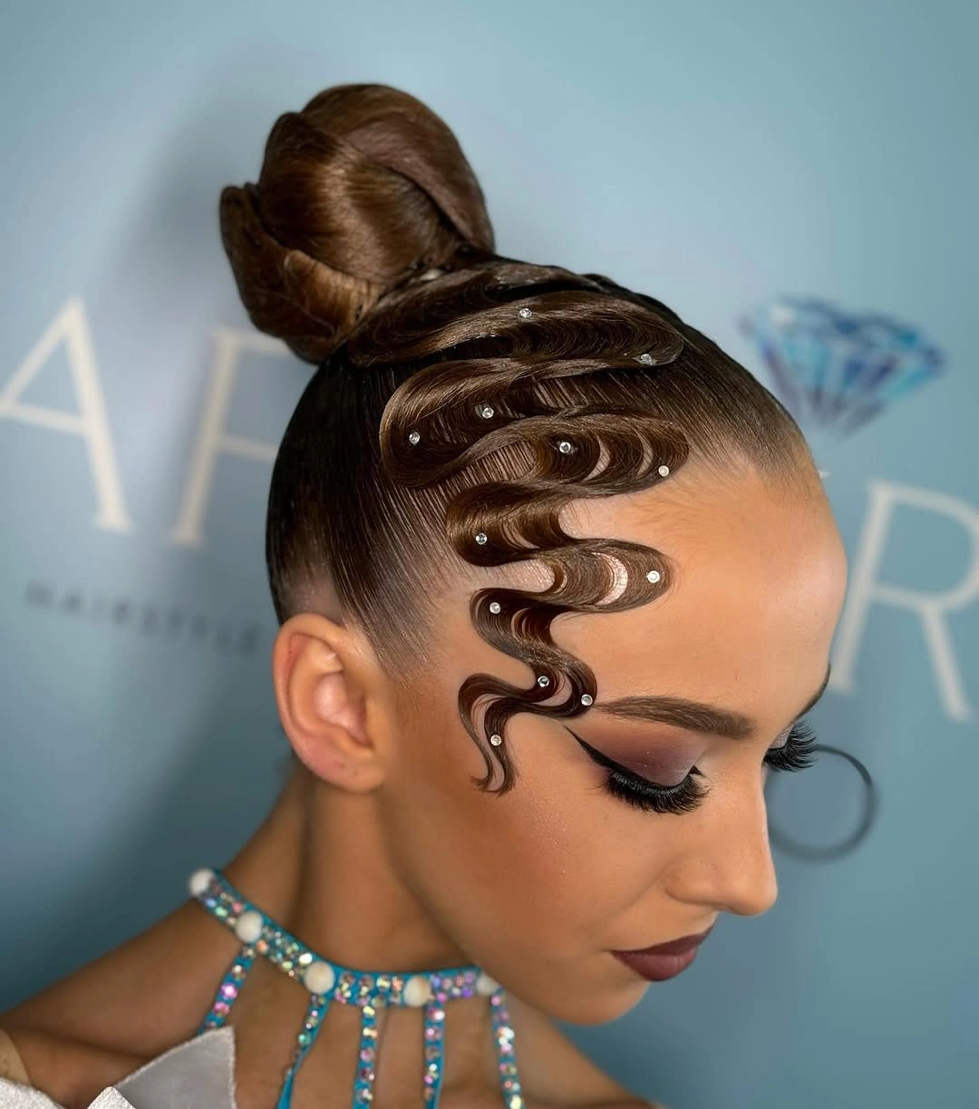 sstylish sports hairstyle Sculpted Bun With Curved Baby Hairs
