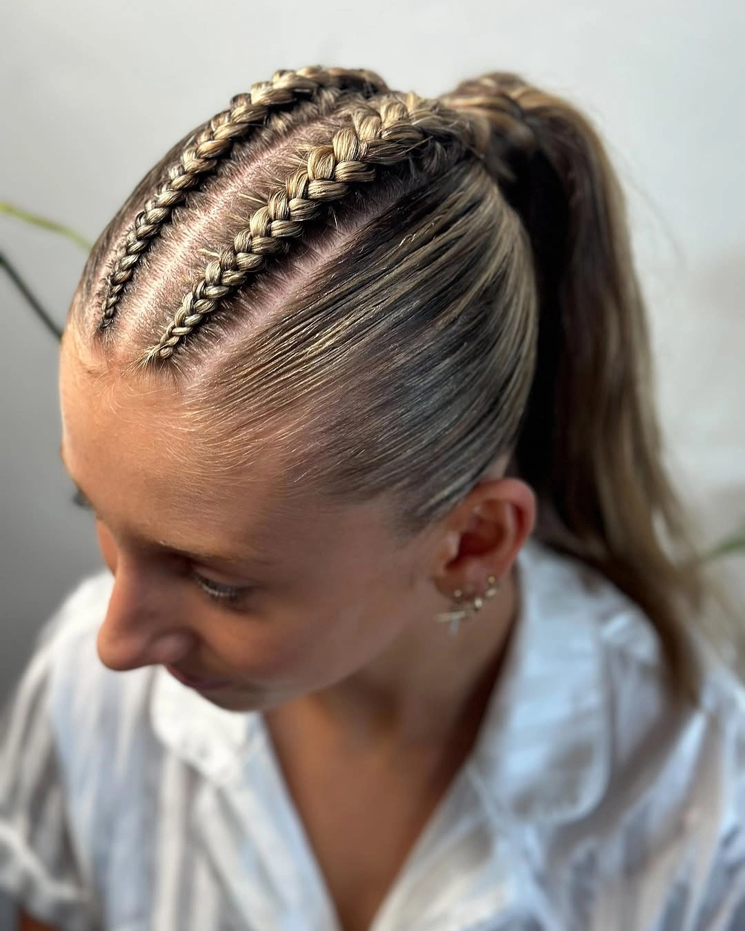 sstylish sports hairstyle Double Braids With a Sleek Ponytail