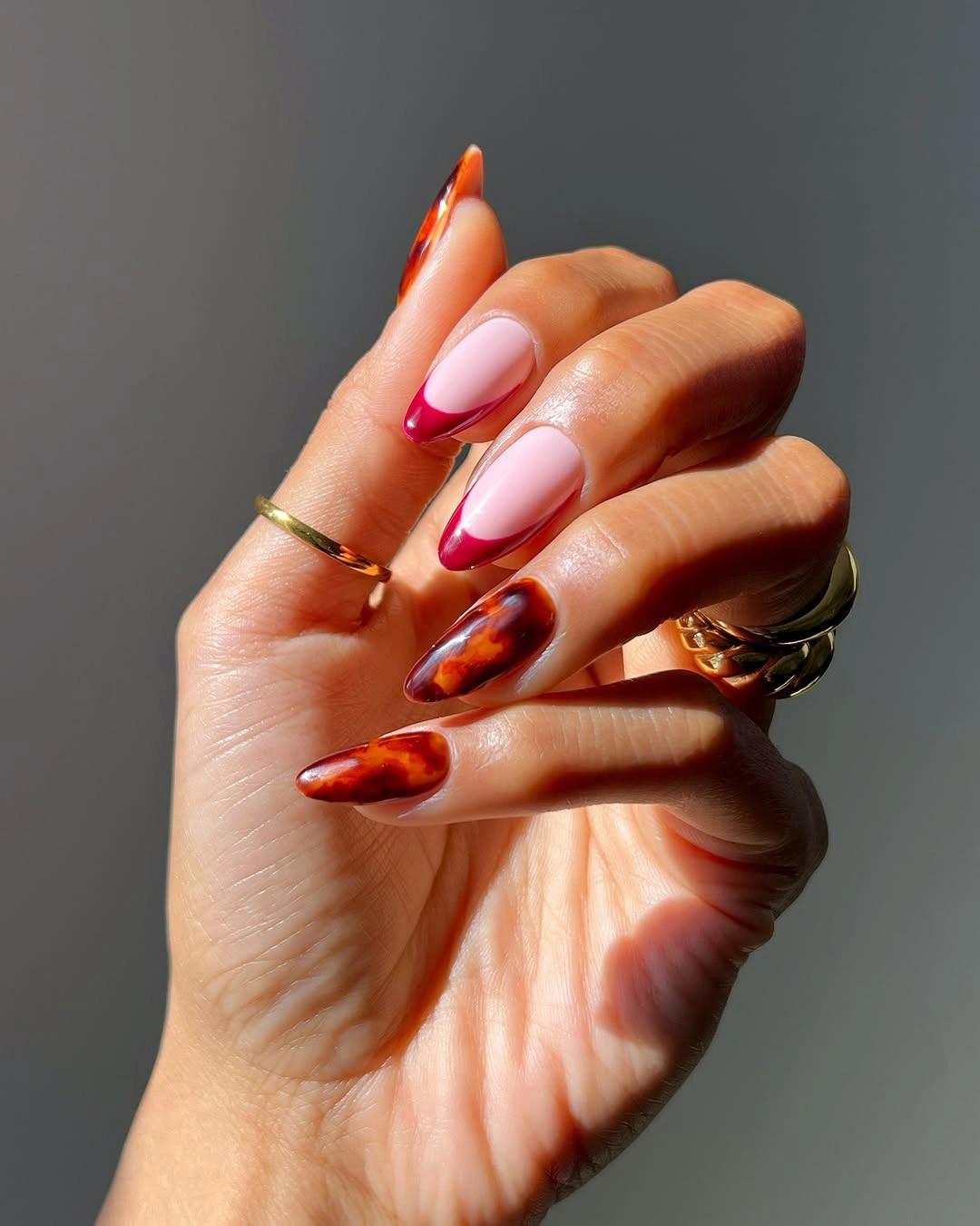 stunning november nails colors 2026 Cherry Tortoiseshell Almond Nails