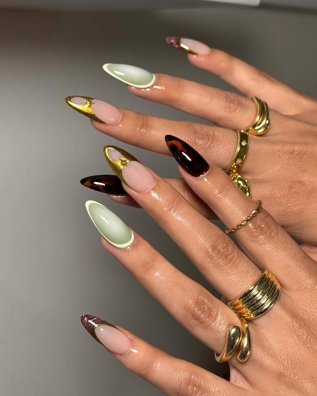 stunning november nails colors 2026 Sage Green Tortoiseshell and Gold Almond Tips