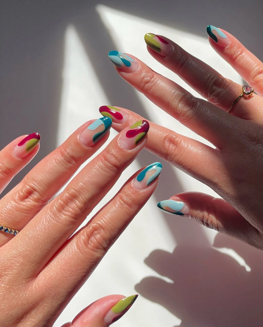 stunning november nails colors 2026 Multicolor Abstract Almond Nails with Jewel-Tone Accents