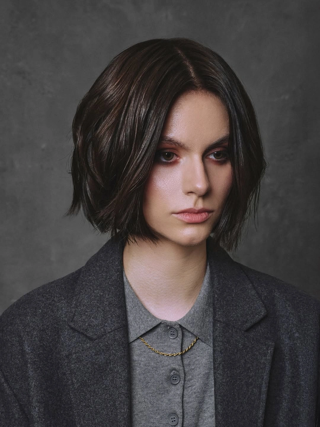 short haircut for women Glossy Brunette Bob With Center Part