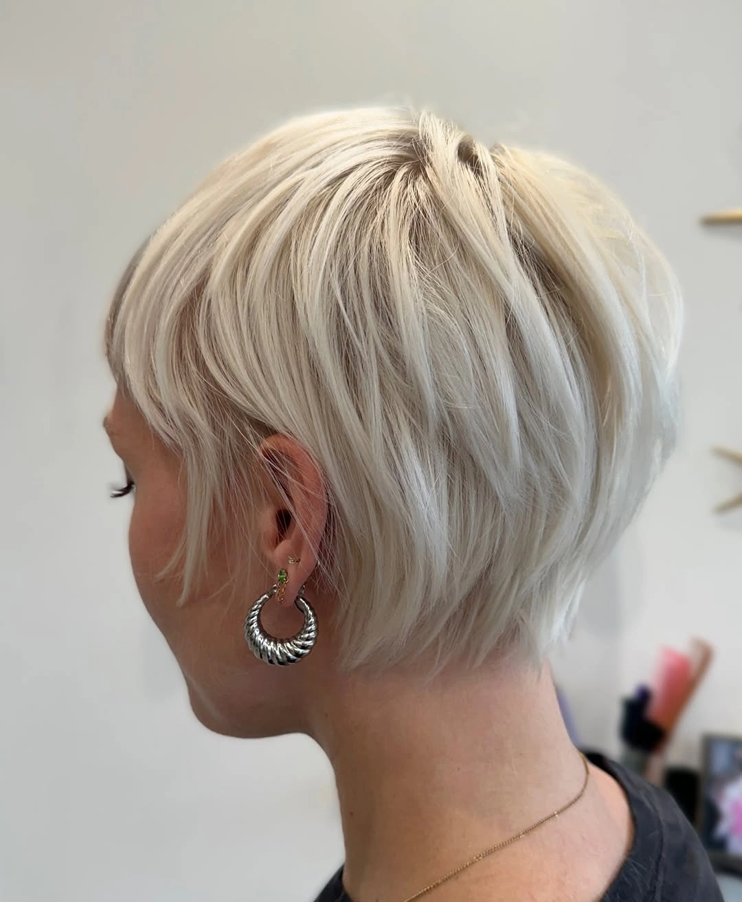 short haircut for women Platinum Blonde Layered Bixie With Airy Texture