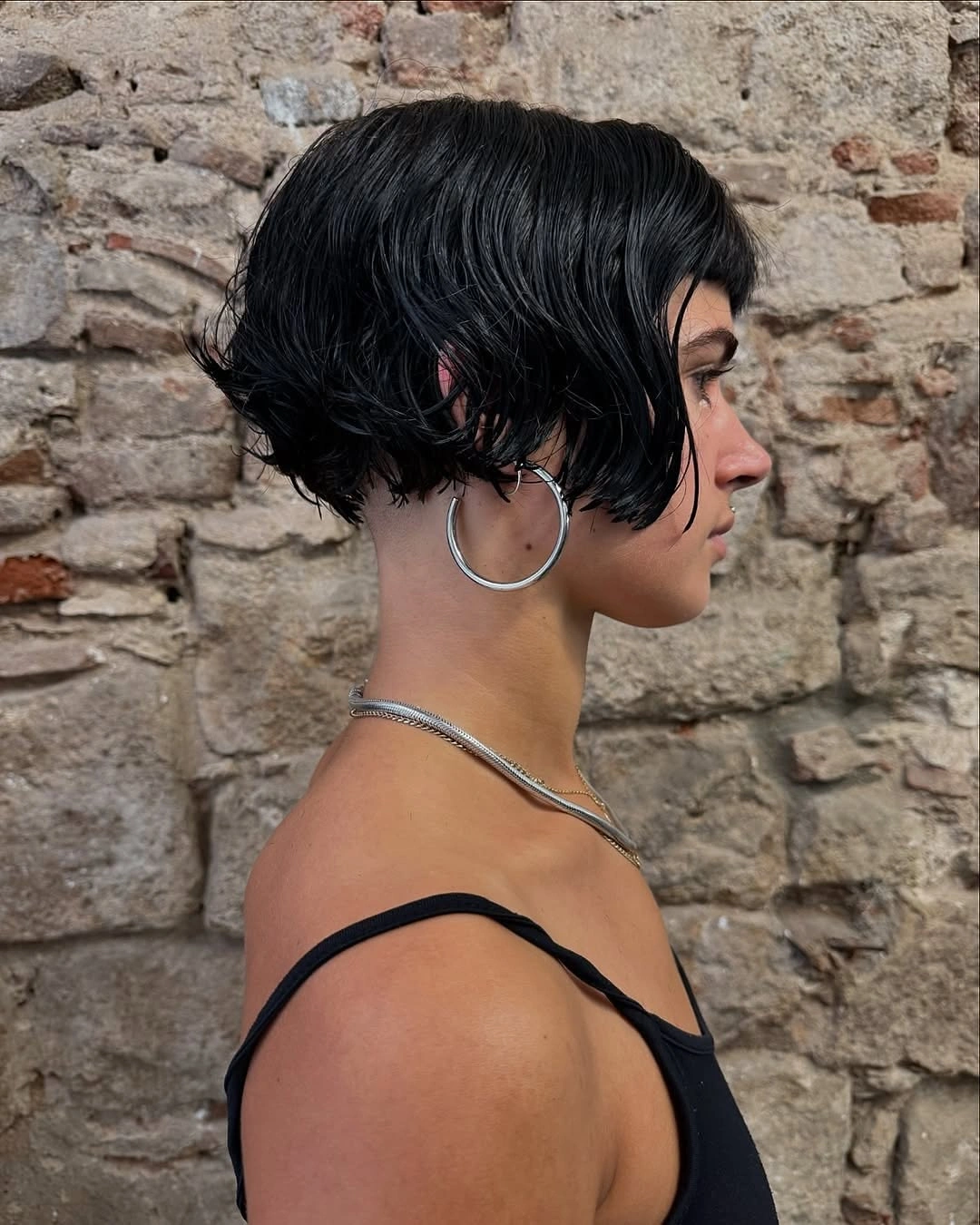 short haircut for women Glossy Black Short Bob With Sculpted Waves