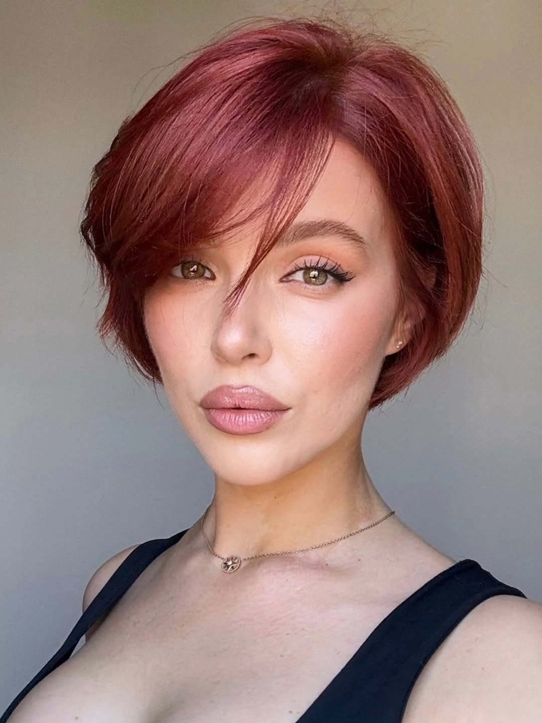 short haircut for women Warm Auburn Rounded Bob With Side-Swept Fringe
