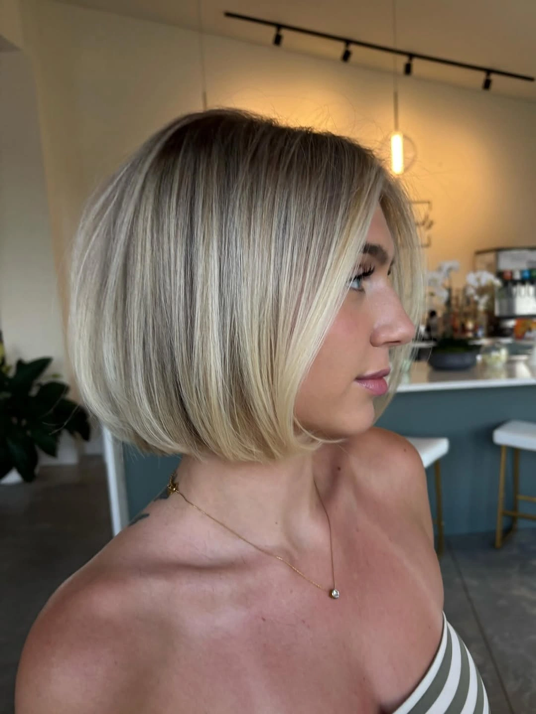 short haircut for women Polished Blonde Bob With Face Framing Layers
