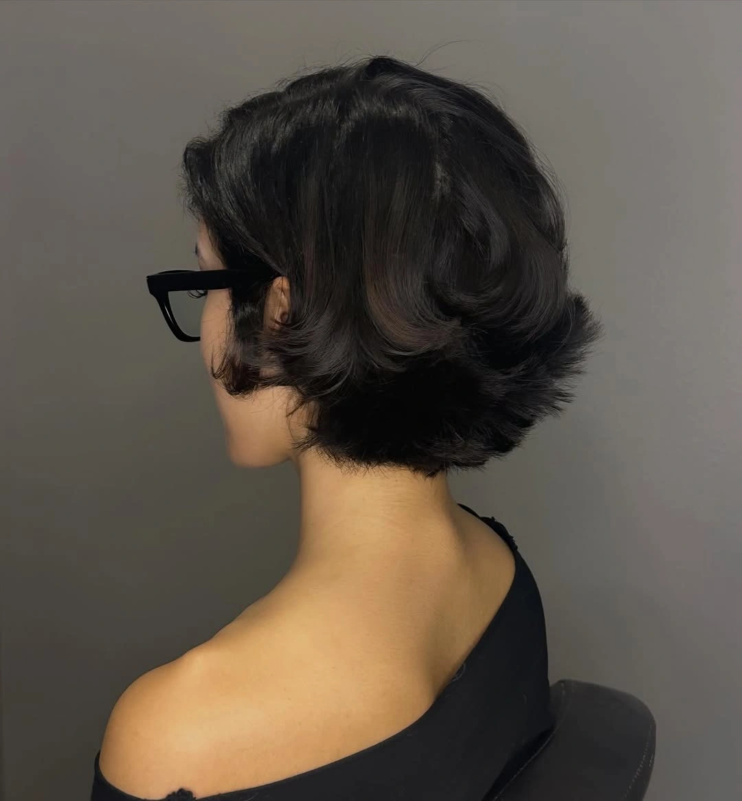 short haircut for women Glossy Black Bob With Vintage Volume