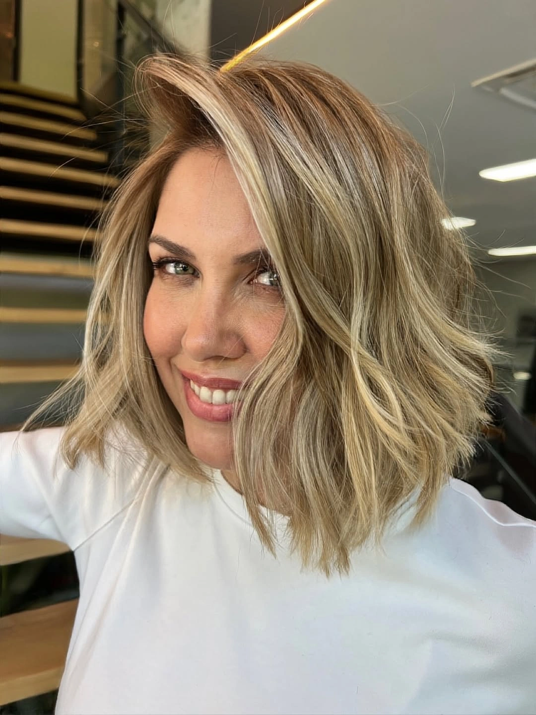 stylish and trendy hairstyles for women over 30 2027 Dimensional Blonde Waves With a Face-Framing Sweep