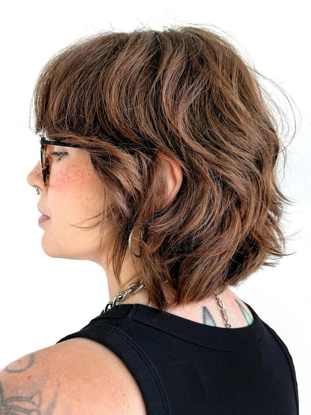 stylish and trendy hairstyles for women over 30 2027 Layered Brunette Bob With Playful Volume