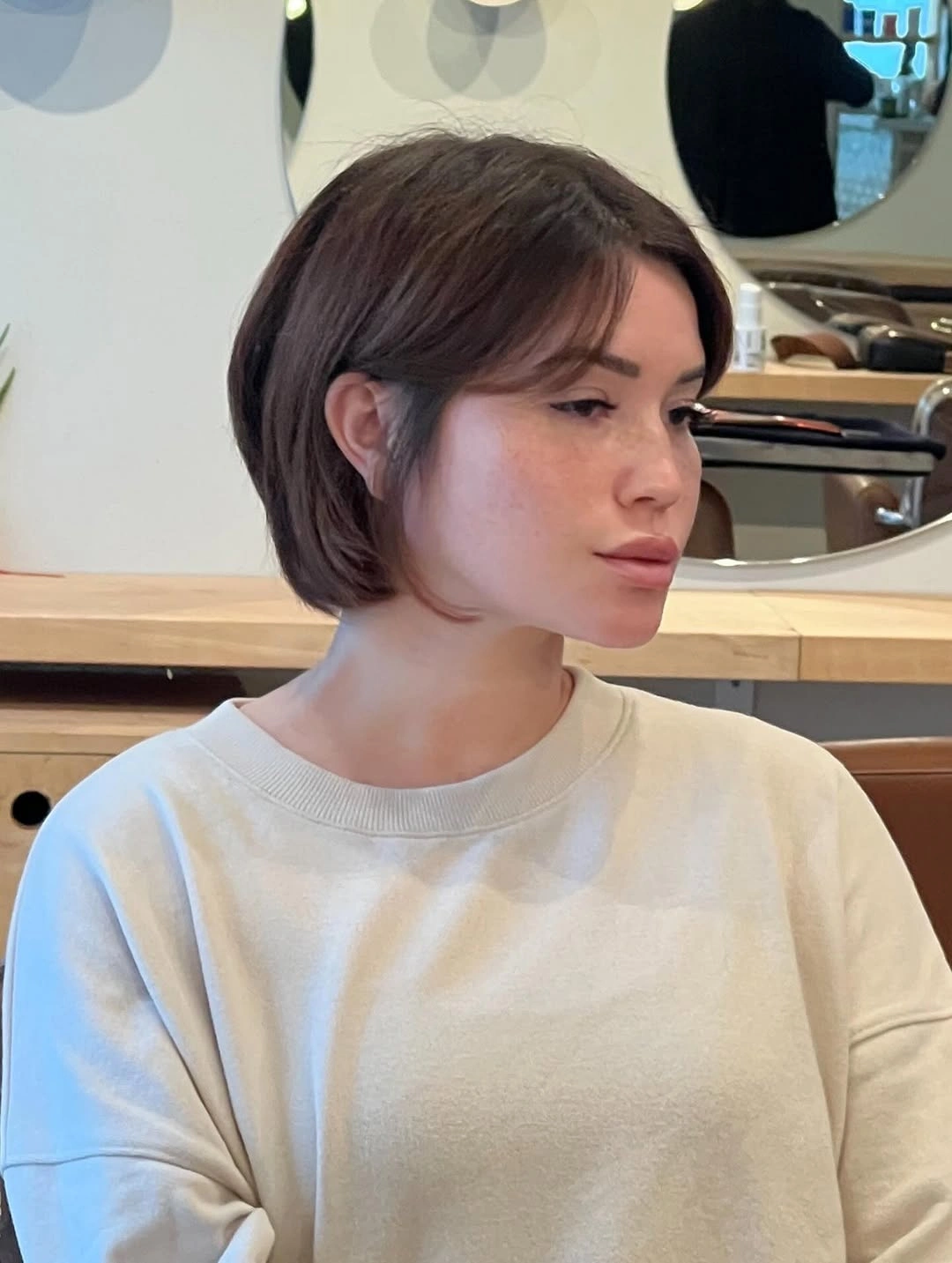 stylish and trendy hairstyles for women over 30 2027 Soft Brunette Bob With Wispy Curtain Bangs