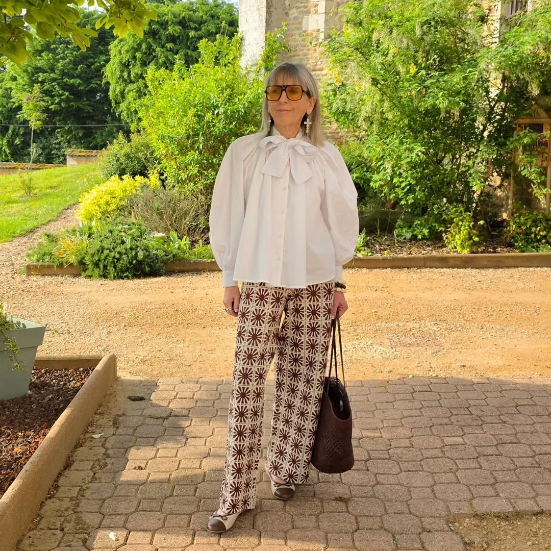 stylish and trendy outfits for women over 50 2027 - Patterned Trousers With a Romantic Bow