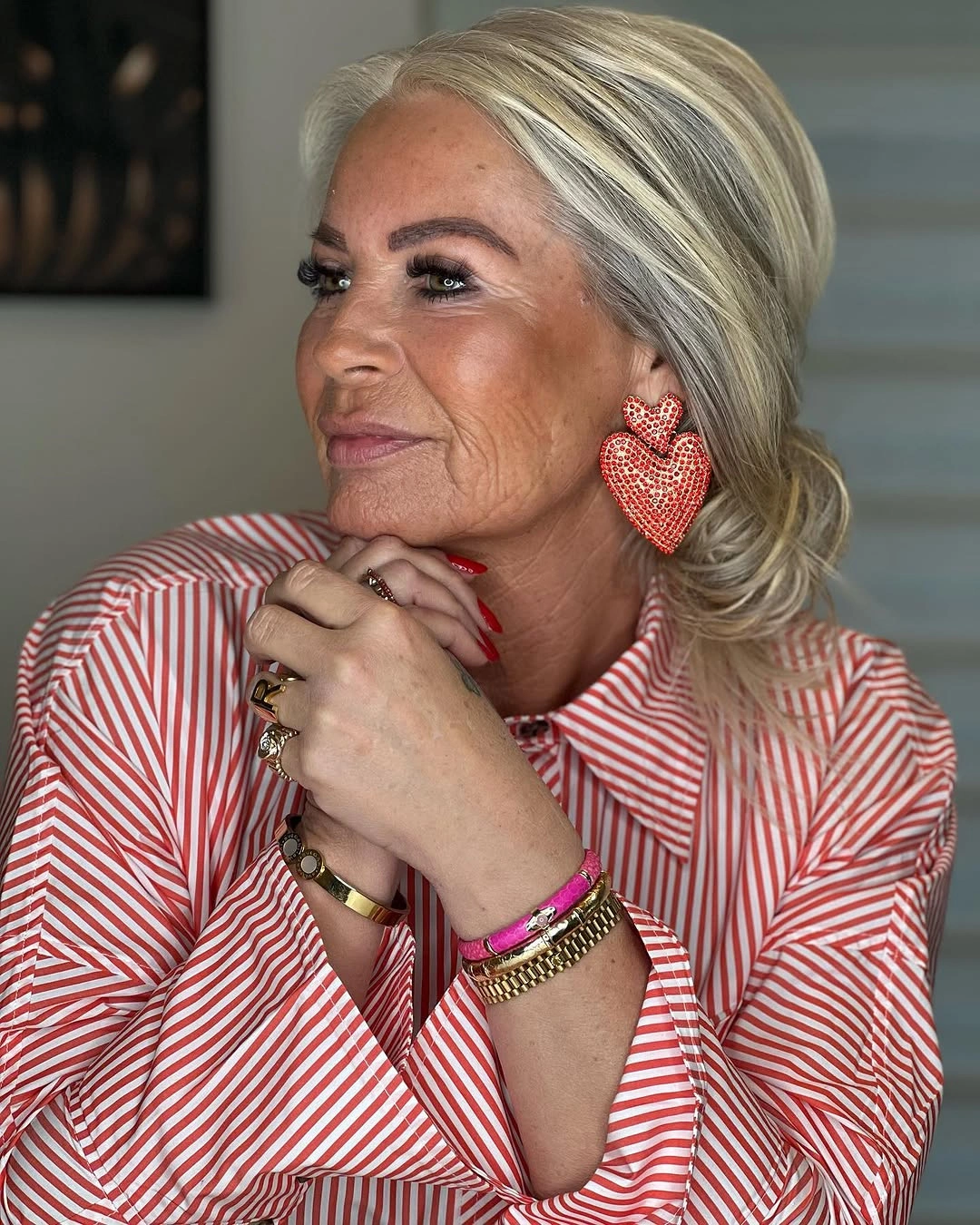 stylish and trendy outfits for women over 50 2027 - Soft Waves With a Statement Red Stripe