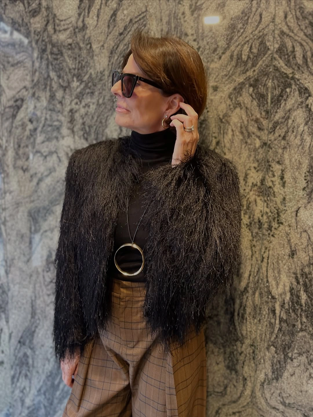 stylish and trendy outfits for women over 50 2027 - Textured Black Layers With a Sophisticated Edge