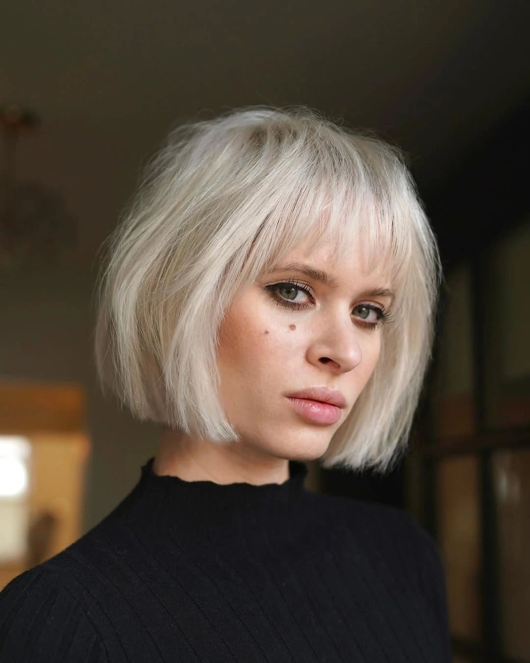 stylish bob with bangs Platinum Blonde Bob With Wispy Fringe