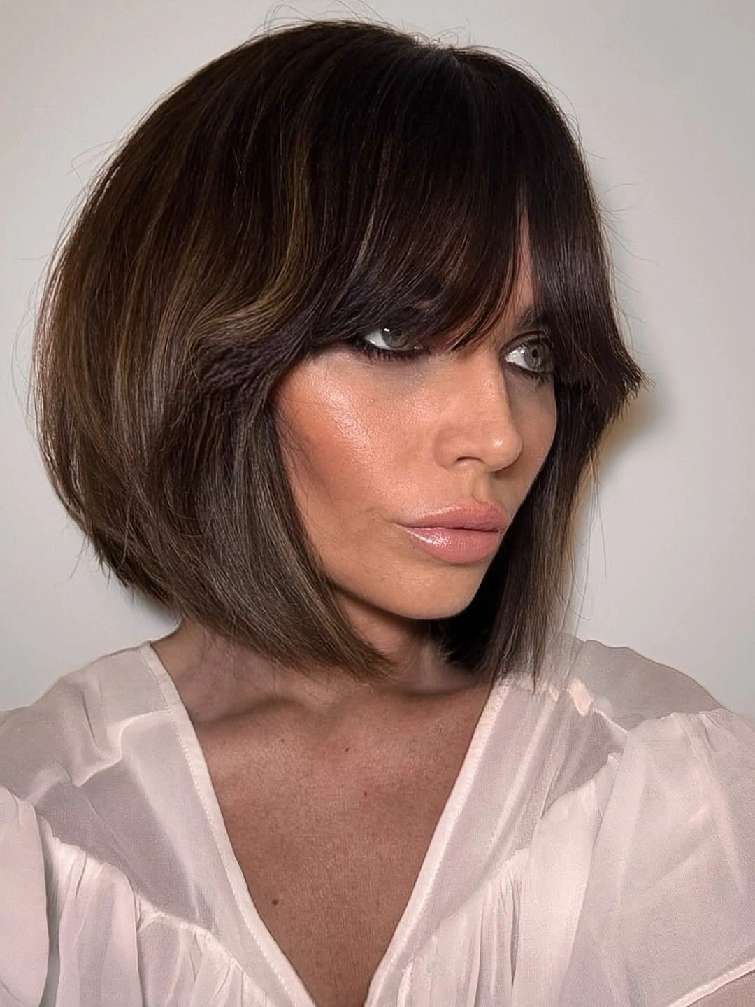 stylish bob with bangs Textured Brunette Bob With Sweeping Fringe