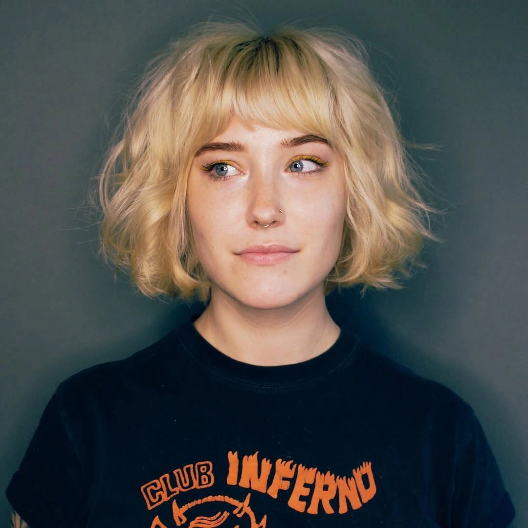 stylish bob with bangs Wavy Blonde Bob With Soft Bangs