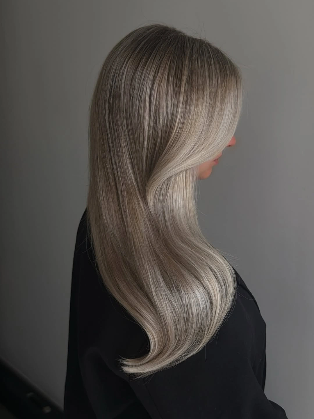 stylish winter haircuts Long Silver Waves With Face-Framing Layers