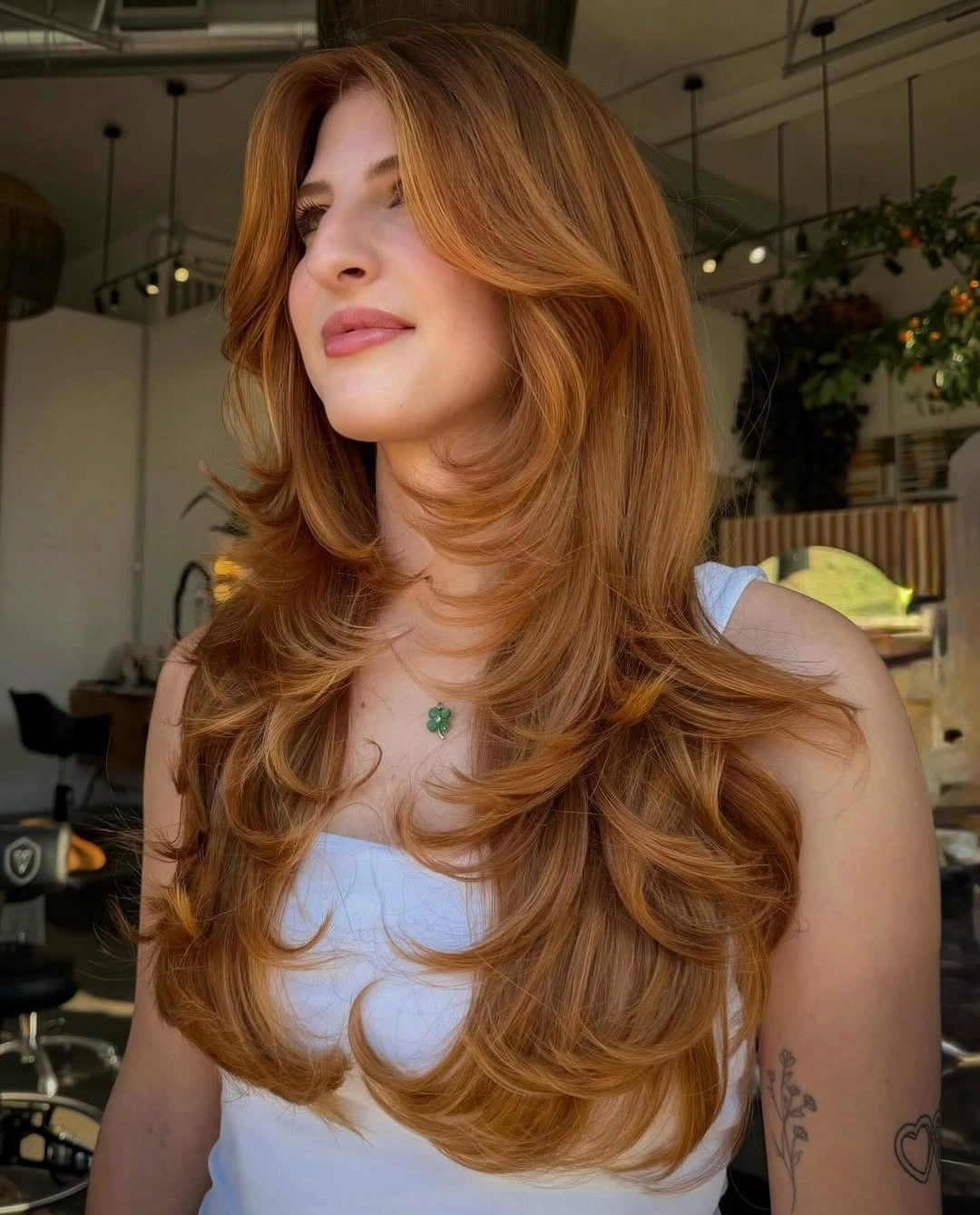 stylish winter haircuts Voluminous Copper Layers With Curtain Bangs
