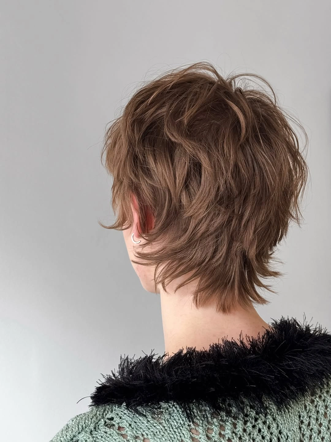 stylish winter haircuts Textured Brown Shag With Feathered Layers