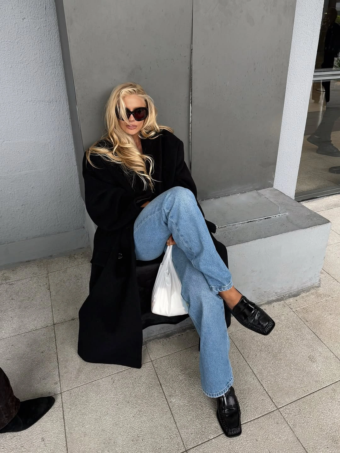 trendy november fashion trends 2026 - Black Coat and Relaxed Denim