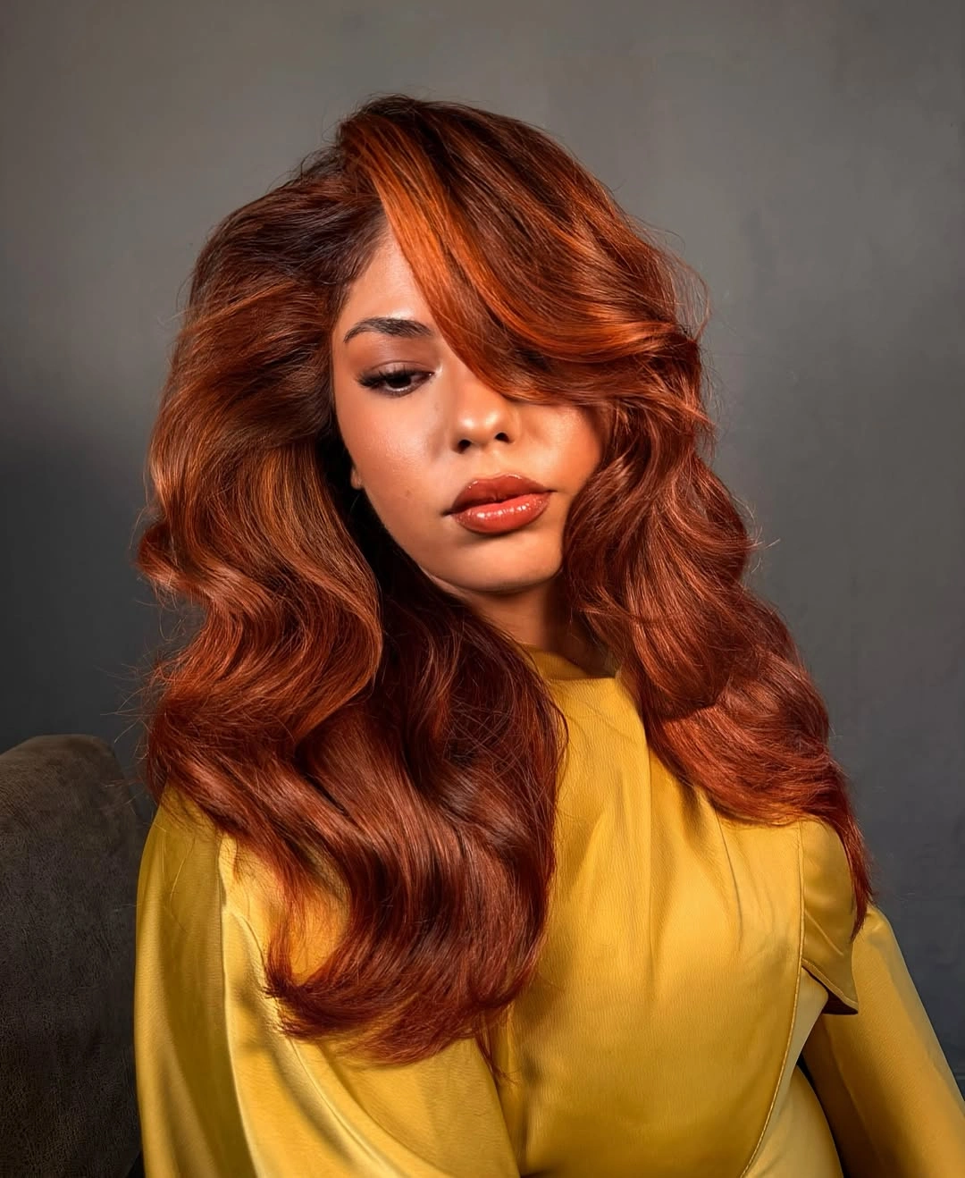 trendy winter hair colors Glossy Copper Waves With a Warm Winter Glow