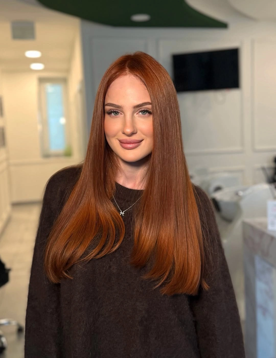 trendy winter hair colors Rich Auburn With Sleek Long Layers