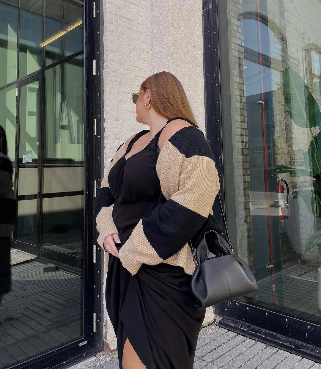 trendy winter outfit for plus size women Black dress and statement cardigan