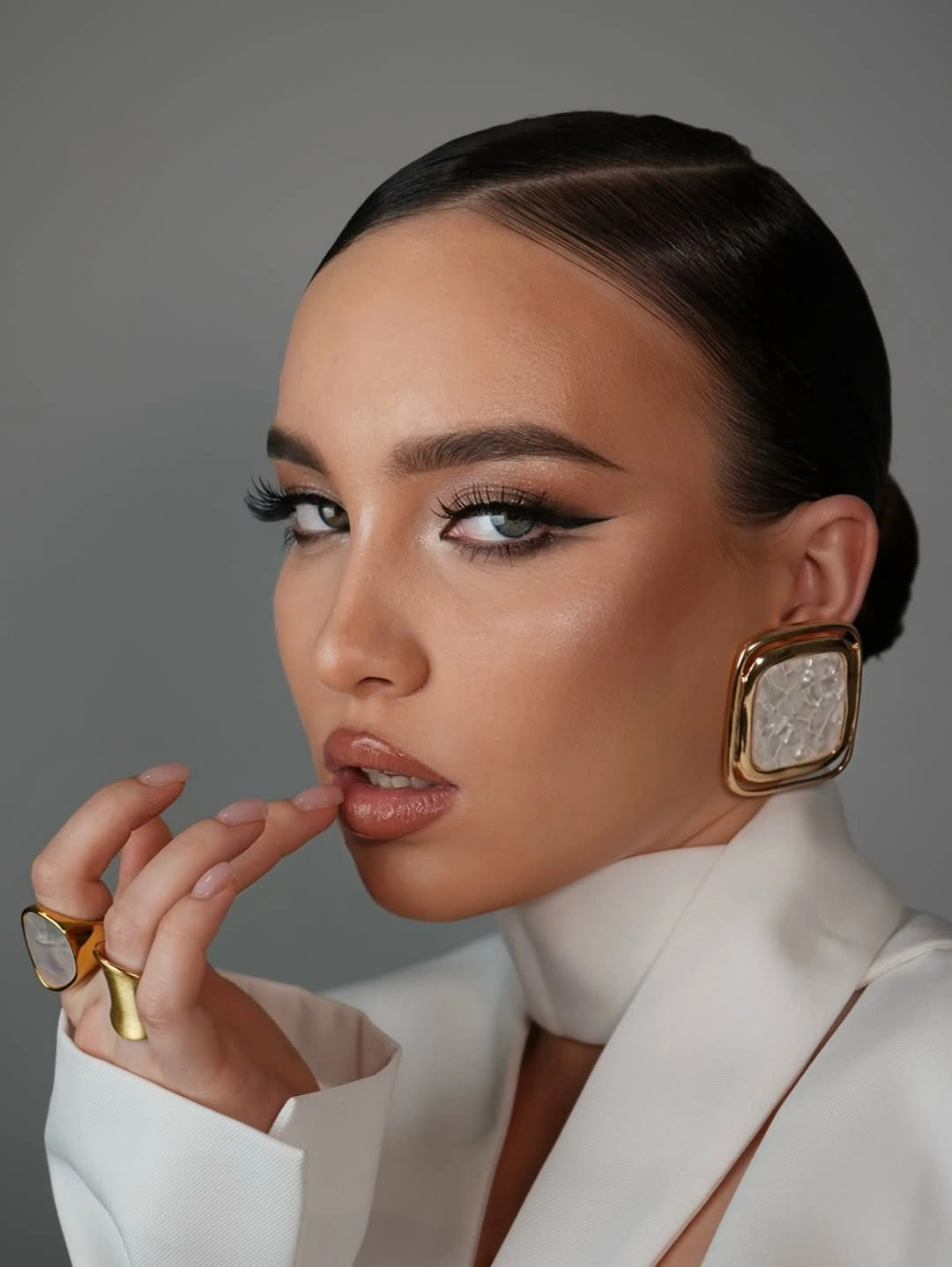 up hairstyle for every occasion Sleek Low Bun With Statement Earrings