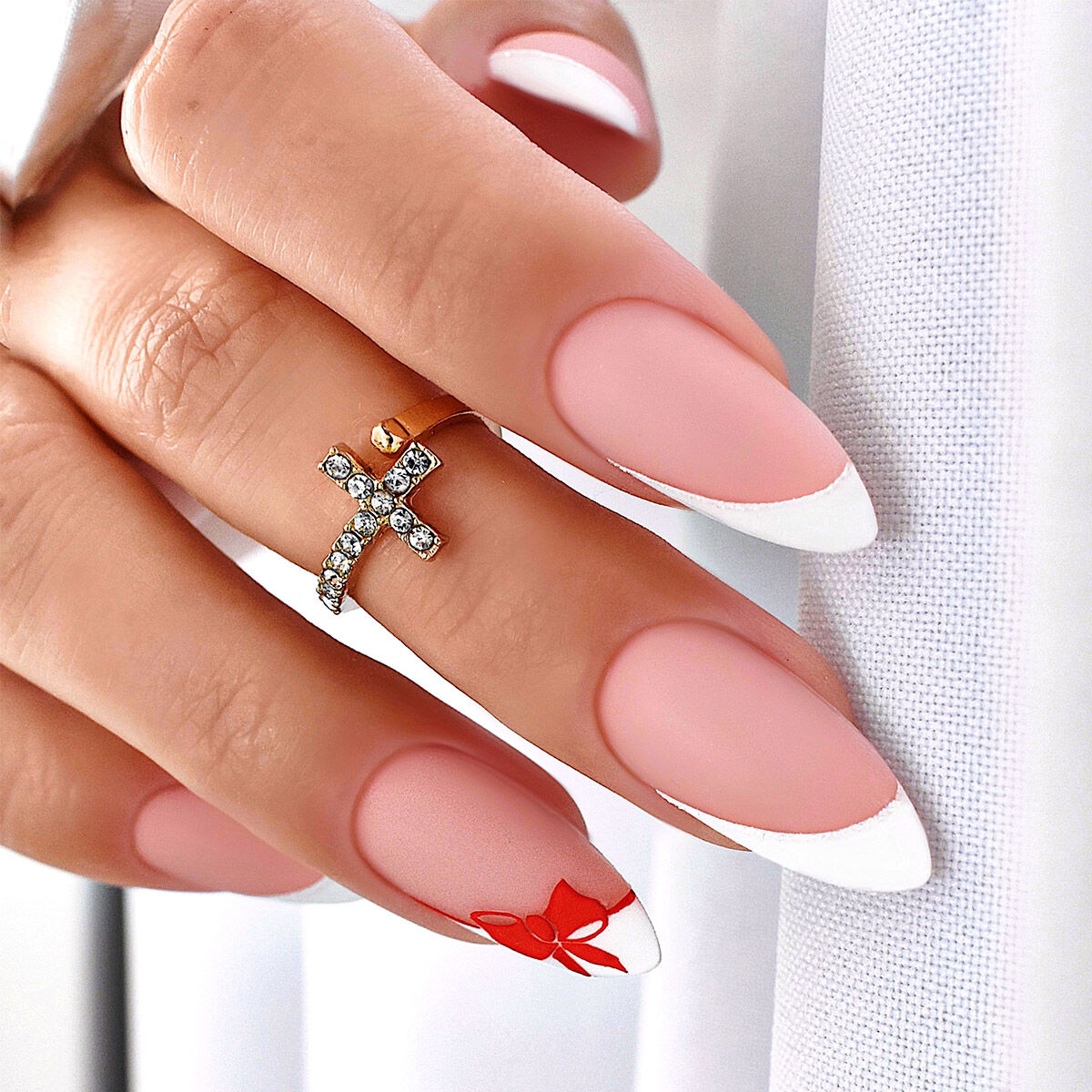 Matte Pink Stiletto with Red Bow Accent Matte Pink Stiletto with Red Bow Accent β Winter French Tip Nails