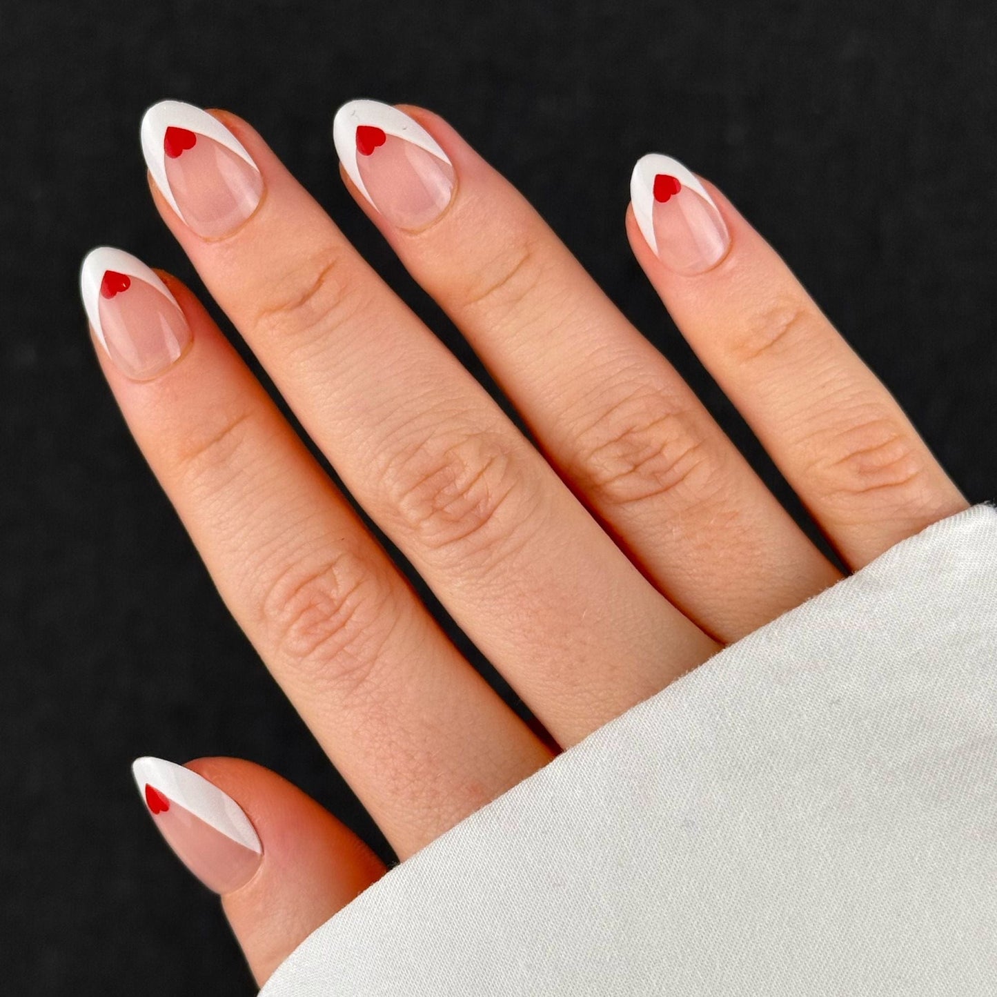 French Almonds with Red Heart Detail French Almonds with Red Heart Detail โ Short Winter Almond Nails