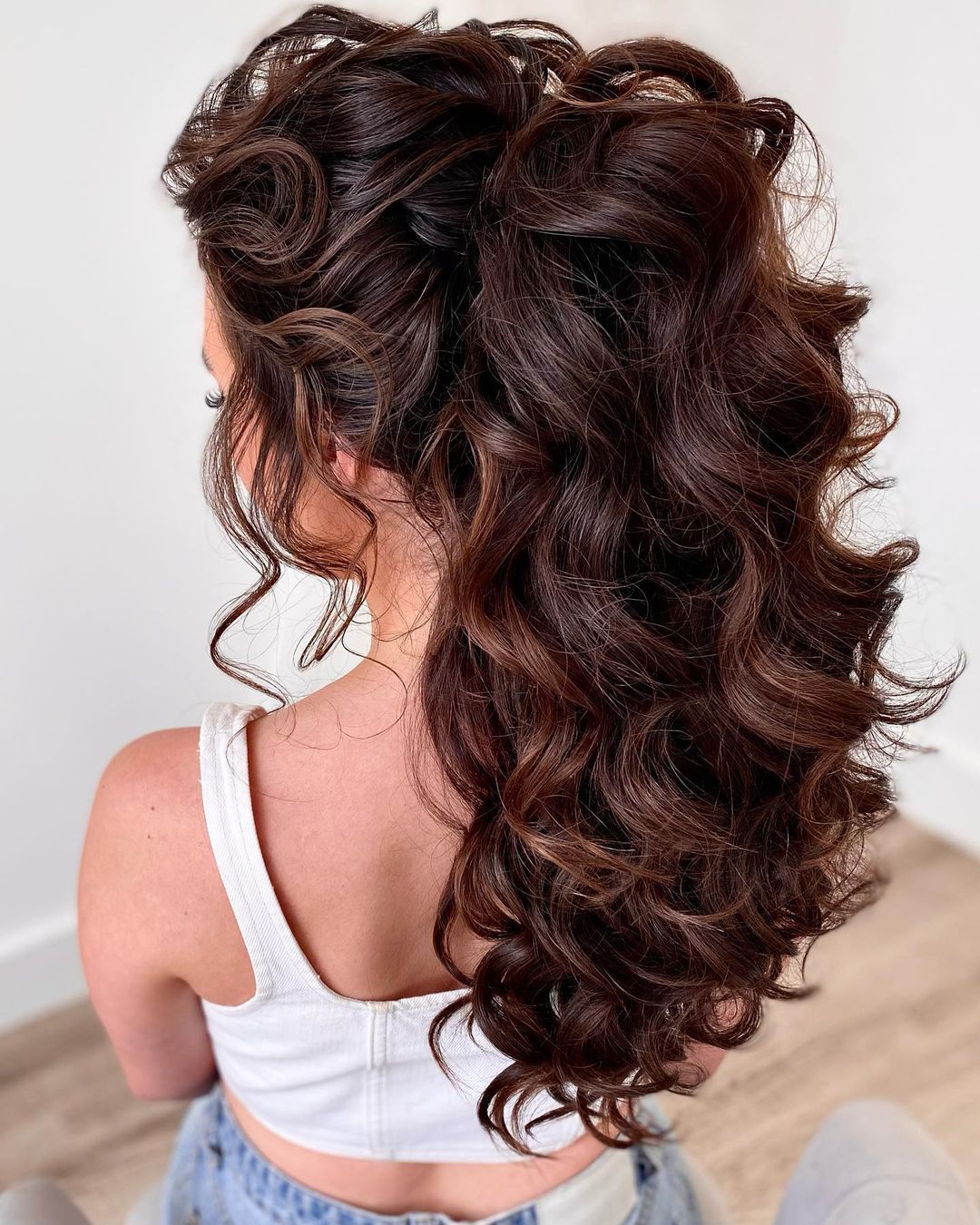 Dark Brown High Ponytail With Curls Dark Brown High Ponytail With Curls β Winter Wedding Guest Hairstyles