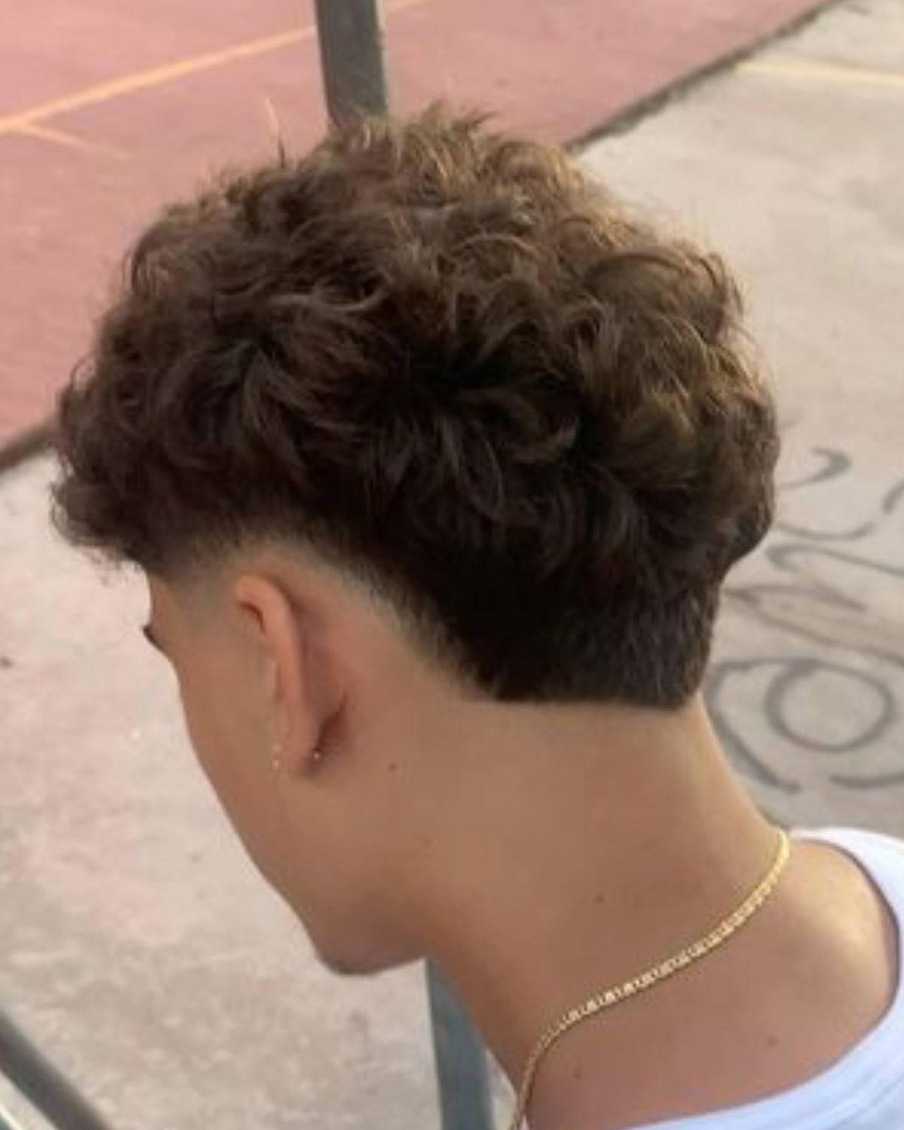 Taper Fade with Textured Curly Top — Winter Haircuts for Men