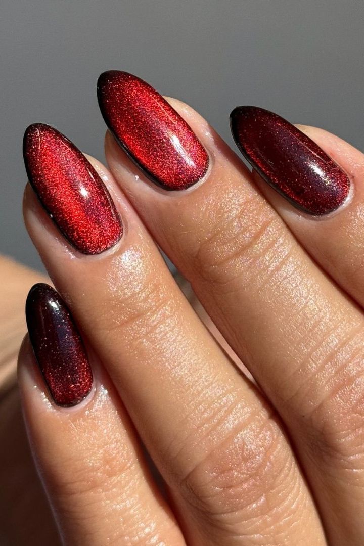 Magnetic Red Gold Cat-Eye Stiletto Nails Magnetic Red Gold Cat-Eye Stiletto Nails β Holiday Party Nails 2026