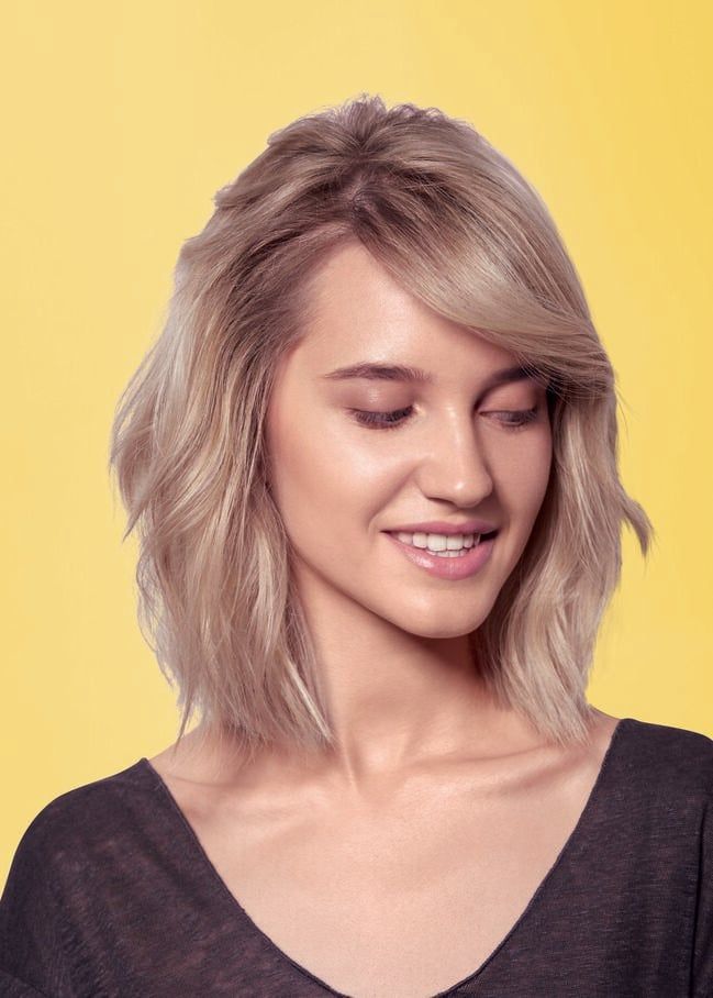 Angled Bob With Side-Swept Bangs — Winter Haircuts with Bangs