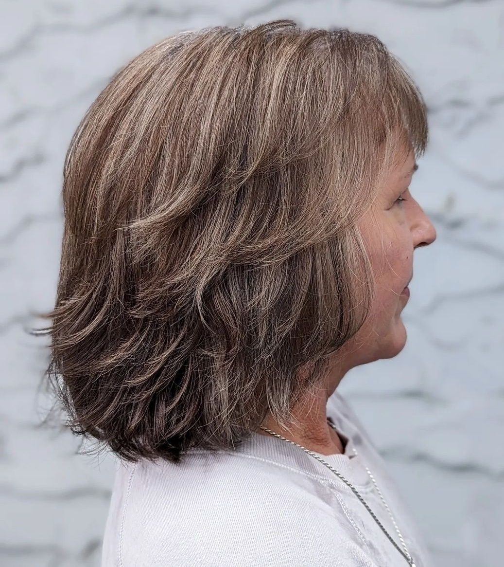 Soft Brown Layered Bob with Side Bangs — Winter Hairstyles for Women Over 50