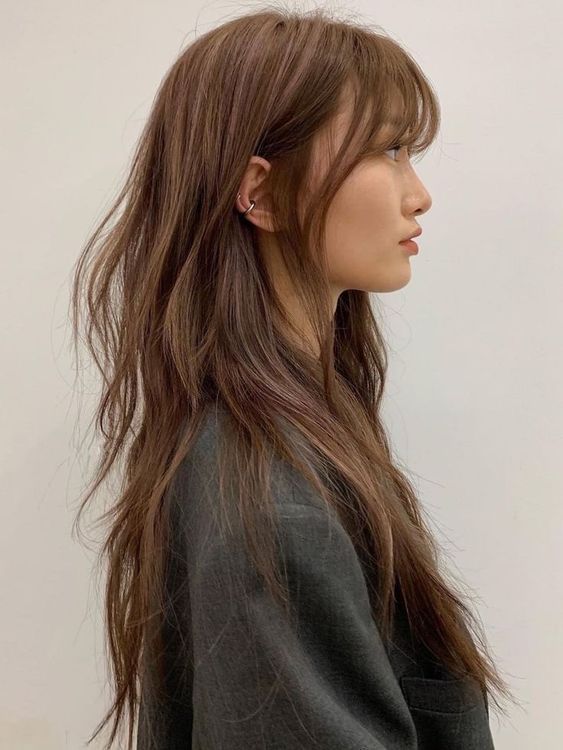 Textured Dark Brown Shag With Wispy Bangs — Winter Haircuts for Long Faces