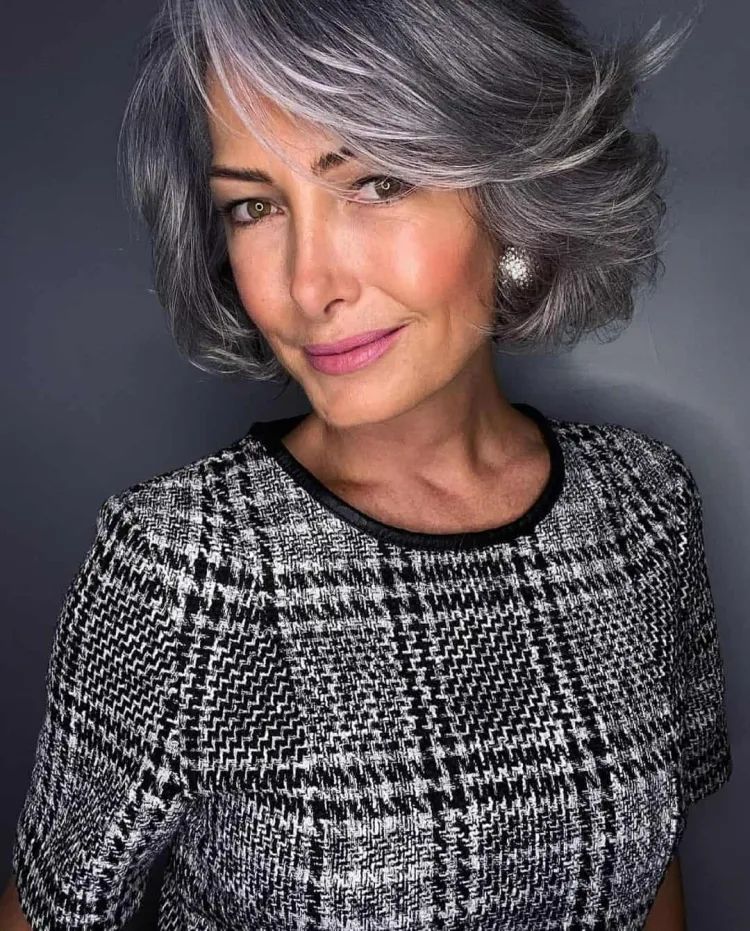 Voluminous Gray Bob With Swept Bangs Voluminous Gray Bob With Swept Bangs β Winter Haircuts for Gray Hair