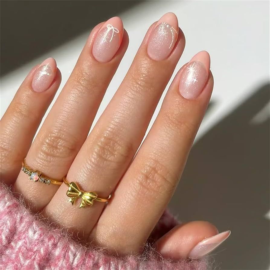 Iridescent Shimmer with Subtle Bow Accent Iridescent Shimmer with Subtle Bow Accent β Short Christmas Almond Nails 2026