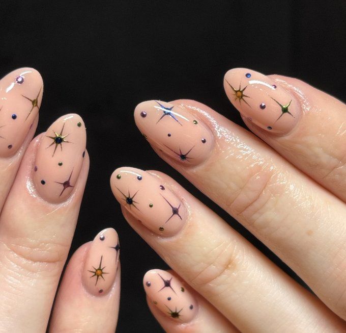 Nude Nails with Scattered Star Motifs — Christmas Nail Designs 2026